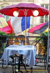 A romantic table for two on the balcony of Le Procope